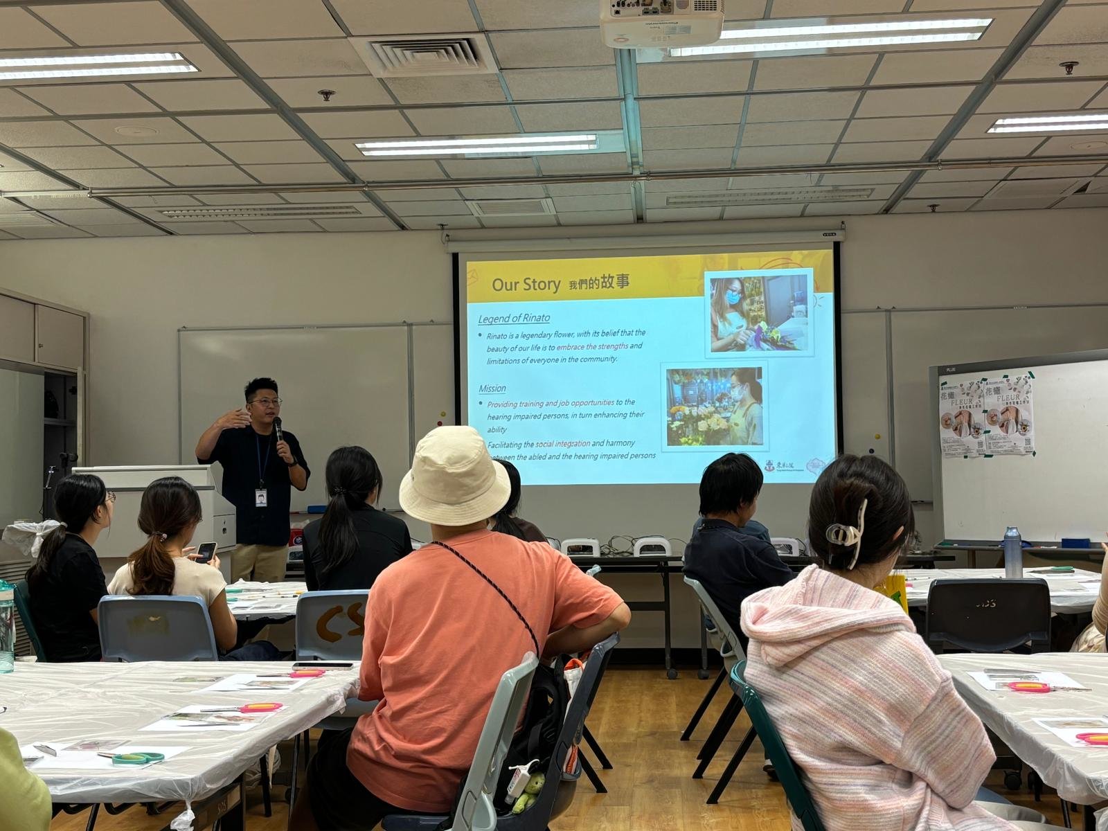 The colleague was introducing the background of their organization. 同事正在介紹他們機構的背景。